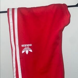 Adidas Red Sweatpants with Iconic Stripes